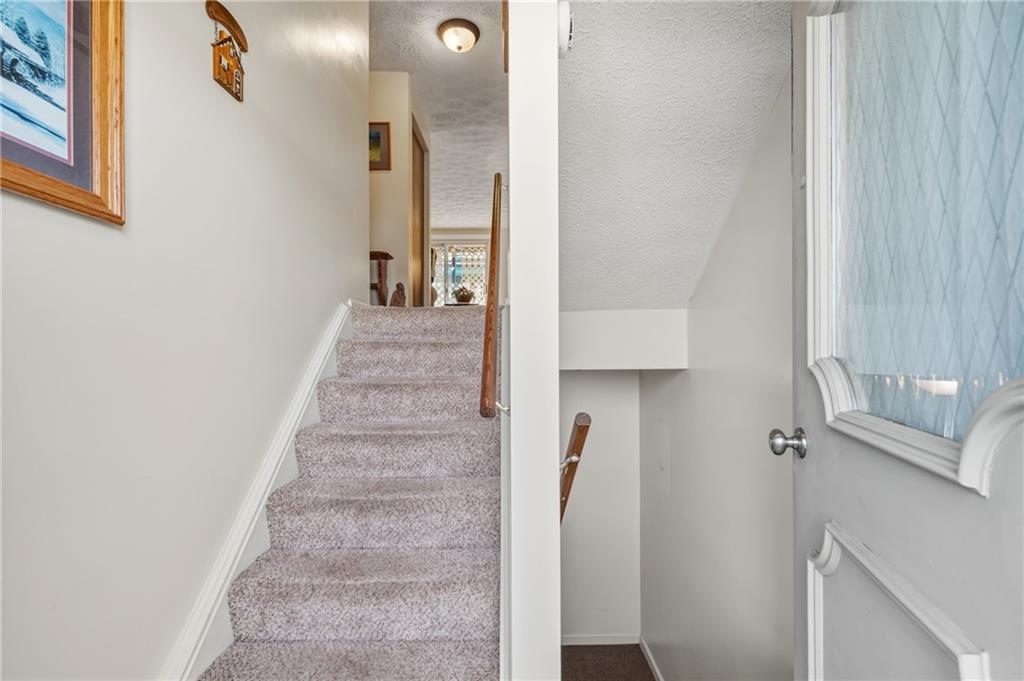11 McKinley Square Coraopolis, PA 15108 - Photo 2 of 26 a view of a hallway with wooden floor and entryway