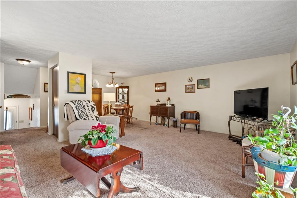 11 McKinley Square Coraopolis, PA 15108 - Photo 8 of 26 a living room with furniture and a flat screen tv
