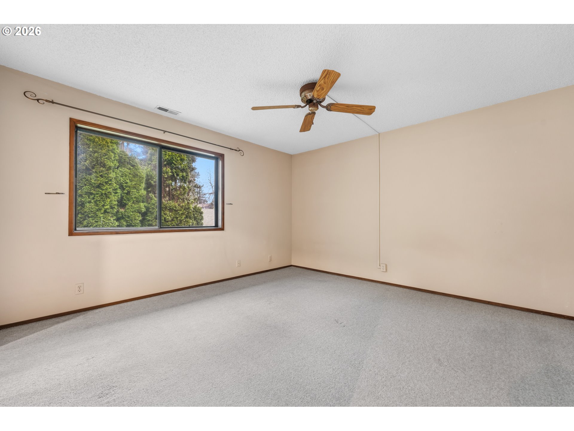 14807 Southwest 106th Avenue Portland, OR 97224 - Photo 26 of 37 a view of room with hardwood floor and window