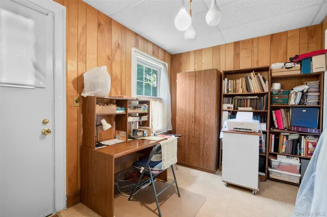 a bedroom with furniture and a window