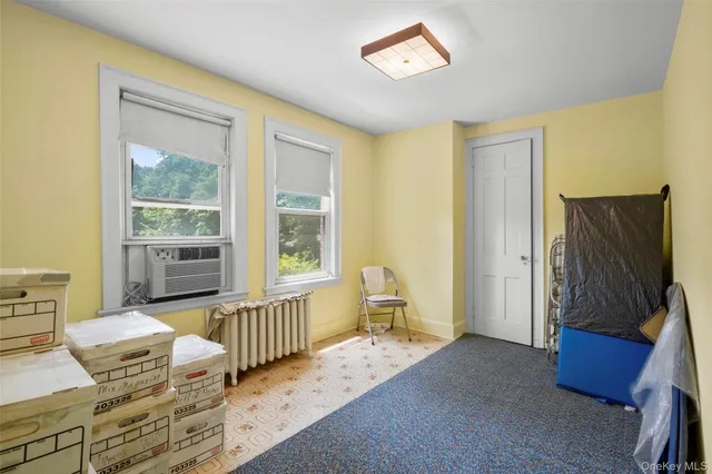 a bedroom with furniture and a window