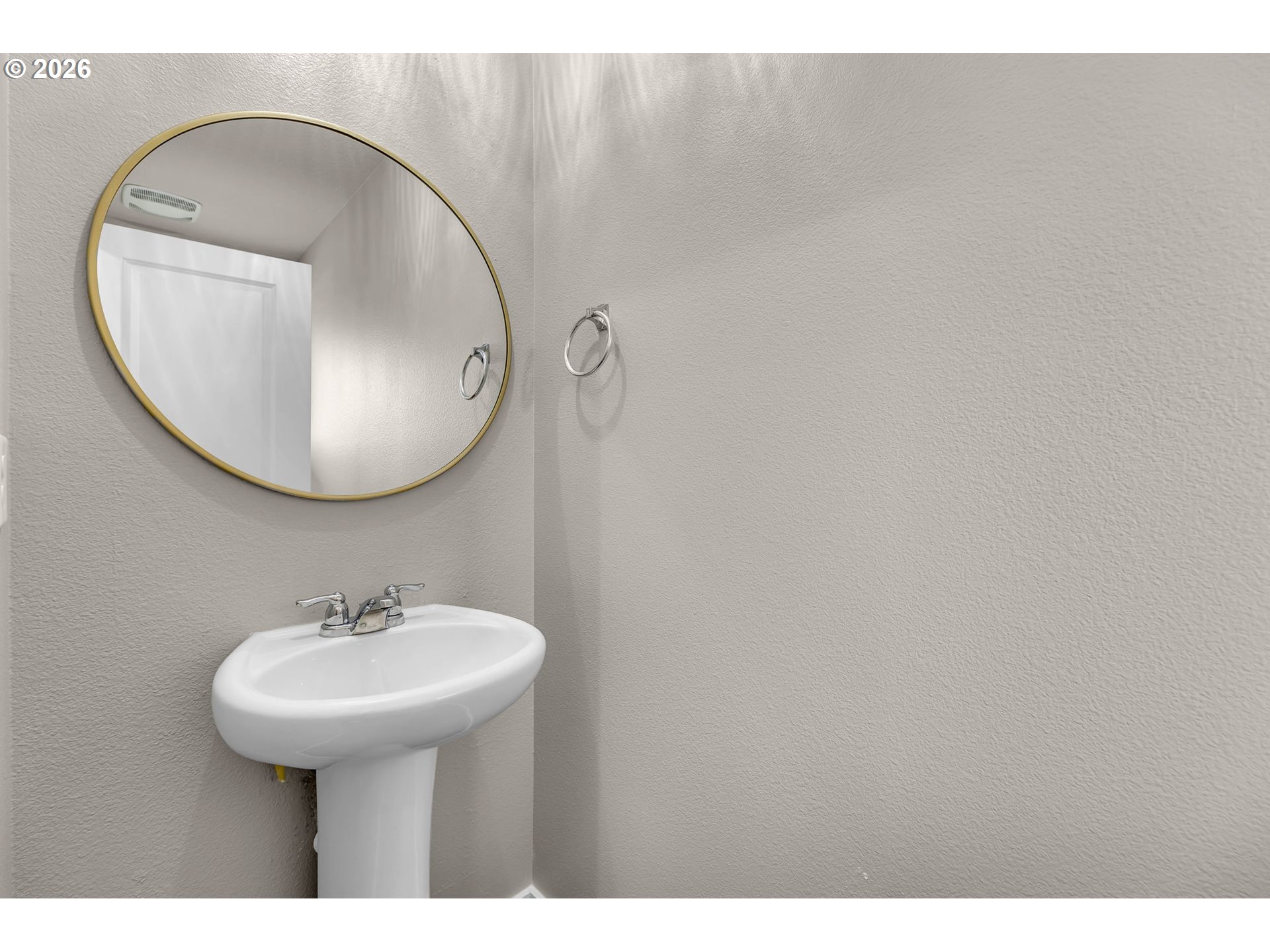 2933 North 3rd Way Ridgefield, WA 98642 - Photo 19 of 37 a bathroom with a sink and a mirror