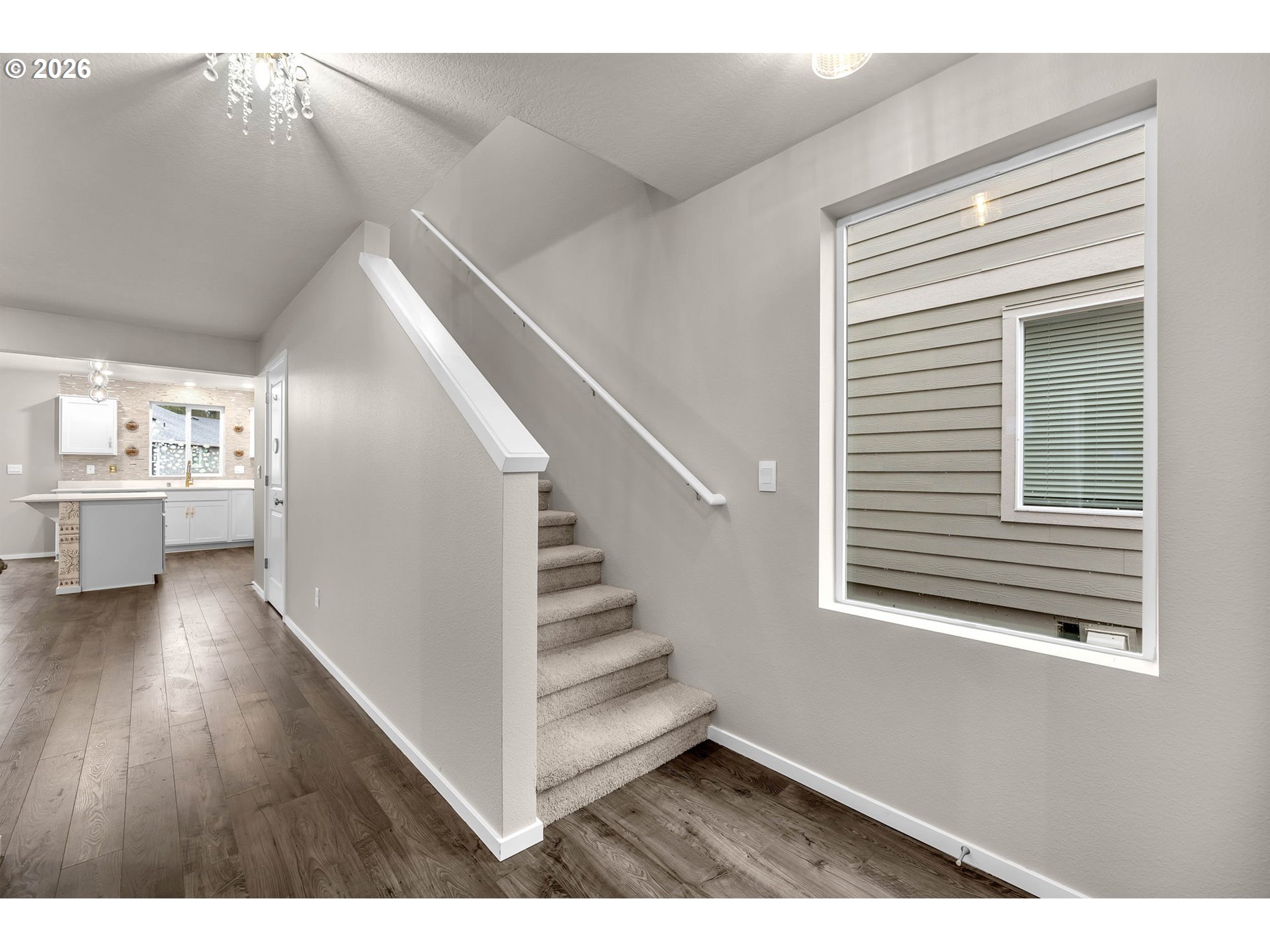 2933 North 3rd Way Ridgefield, WA 98642 - Photo 20 of 37 a view of a hallway with wooden floor and staircase