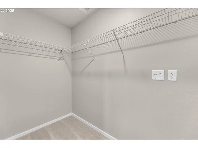 a view of an empty room and a window