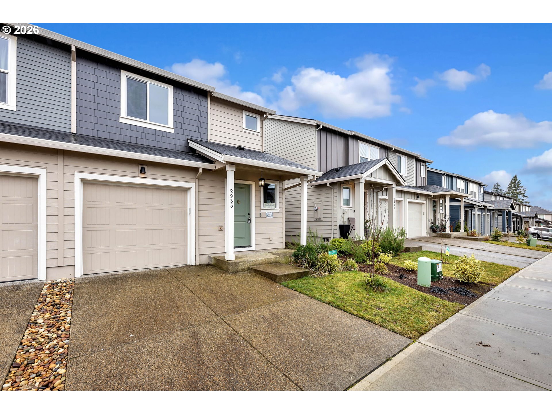 2933 North 3rd Way Ridgefield, WA 98642 - Photo 3 of 37 a front view of a house with garden