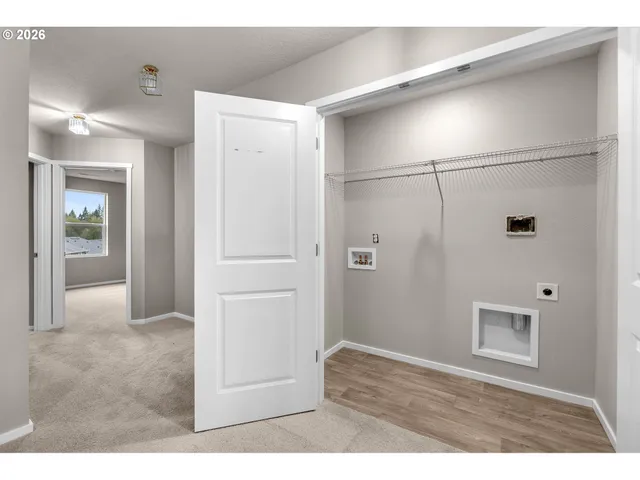 a view of a back yard with a wooden fence