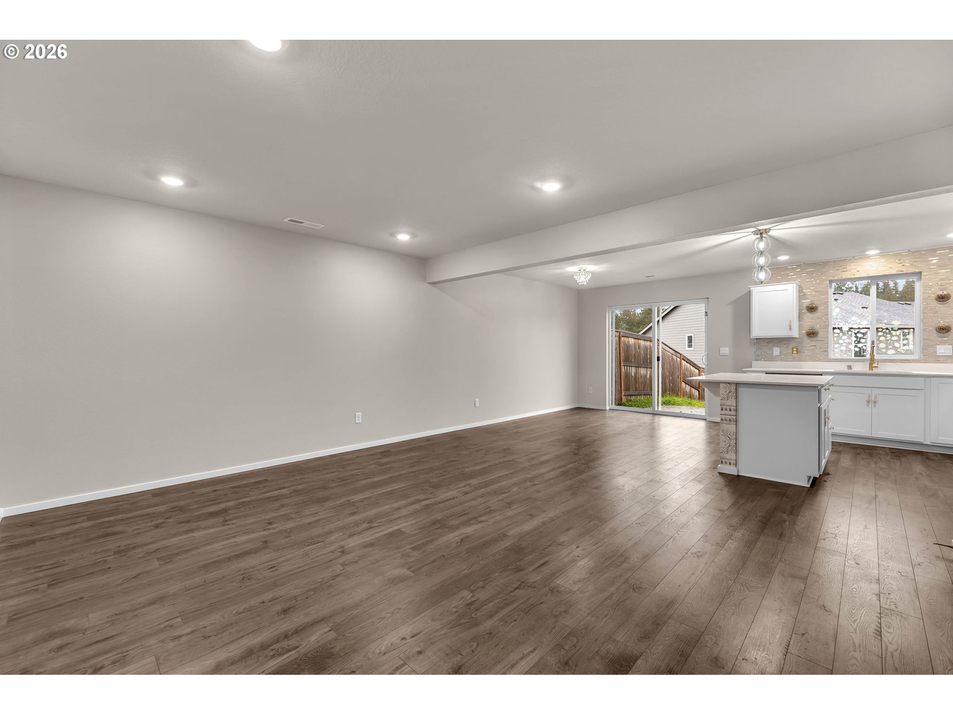 2933 North 3rd Way Ridgefield, WA 98642 - Photo 5 of 37 a view of kitchen and hall with wooden floor