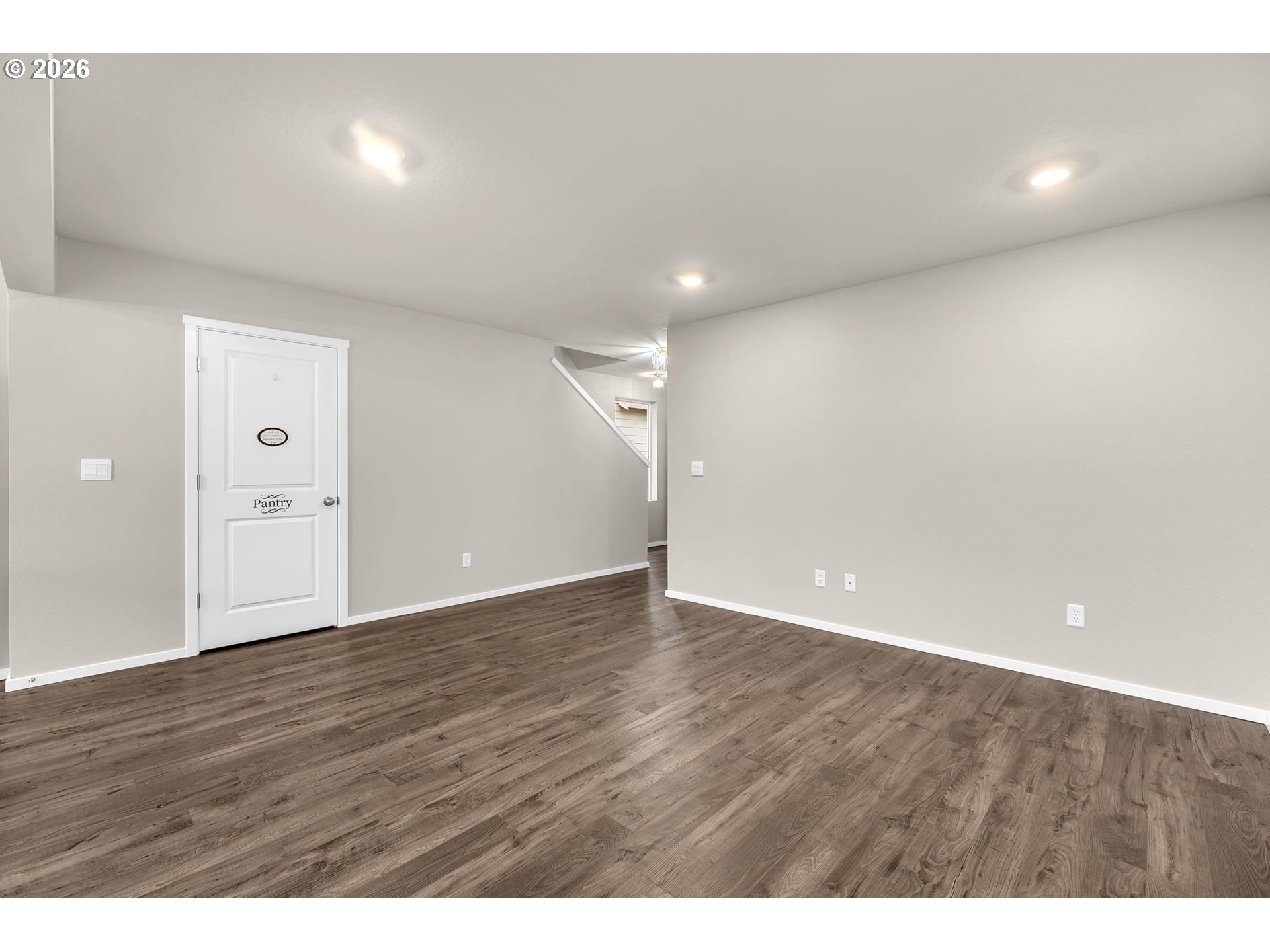 2933 North 3rd Way Ridgefield, WA 98642 - Photo 7 of 37 a view of an empty room with wooden floor