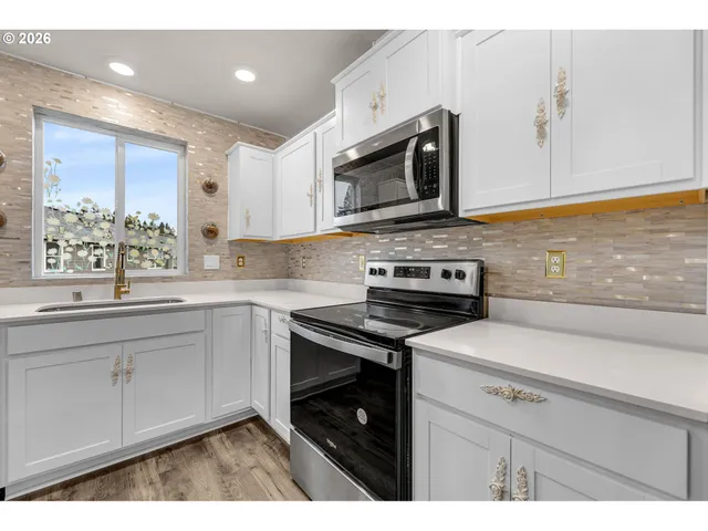 a kitchen with a wooden floor