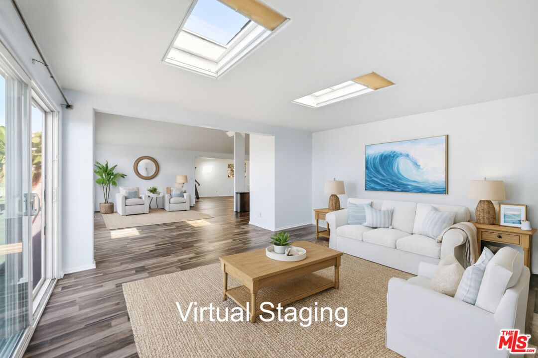 29500 Heathercliff Road, Unit 170 Malibu, CA 90265 - Photo 11 of 38 a living room with furniture and a table