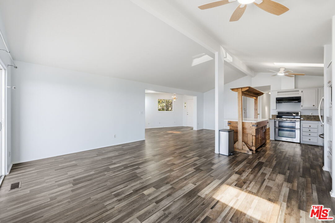 29500 Heathercliff Road, Unit 170 Malibu, CA 90265 - Photo 12 of 38 a view of a kitchen with furniture and wooden floor