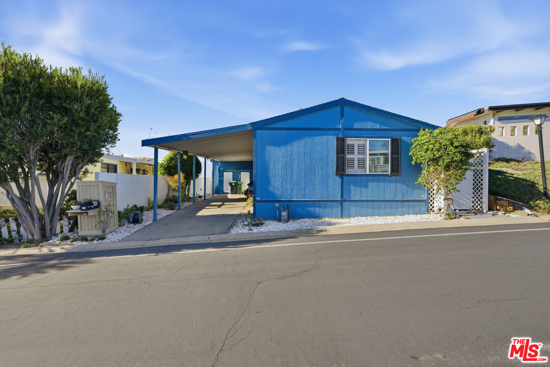 29500 Heathercliff Road, Unit 170 Malibu, CA 90265 - Photo 22 of 38 a front view of a house with a yard