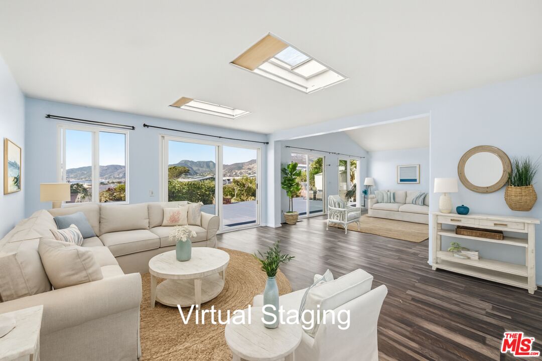 29500 Heathercliff Road, Unit 170 Malibu, CA 90265 - Photo 9 of 38 a living room with furniture and a large window
