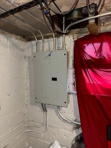 a bathroom with a granite countertop sink and shower