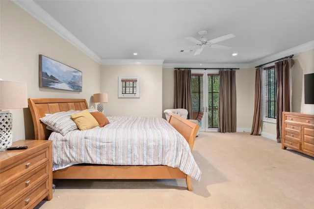 a bedroom with a large bed and a couch