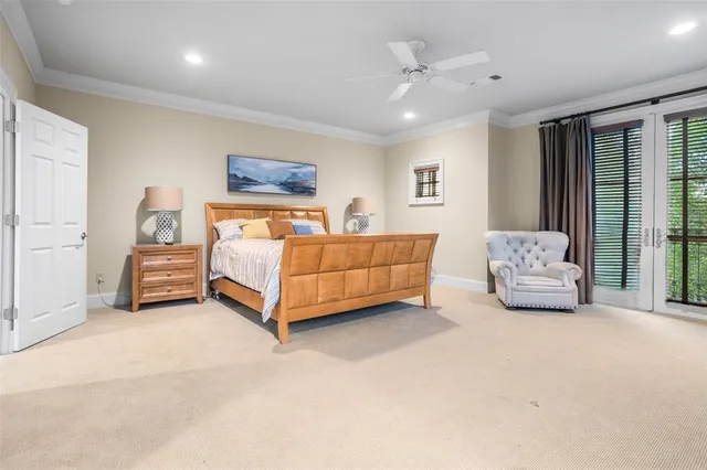 a spacious bedroom with a bed and window