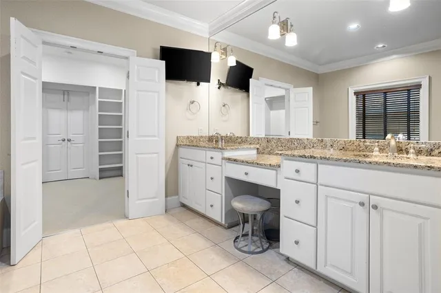 a bathroom with a sink double vanity and a mirror
