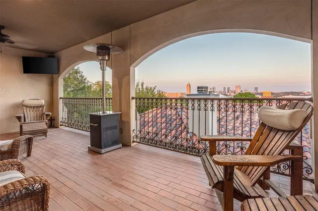 a view of a balcony with furniture