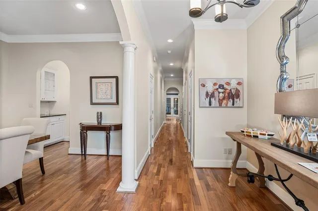 a view of a workspace with furniture and wooden floor