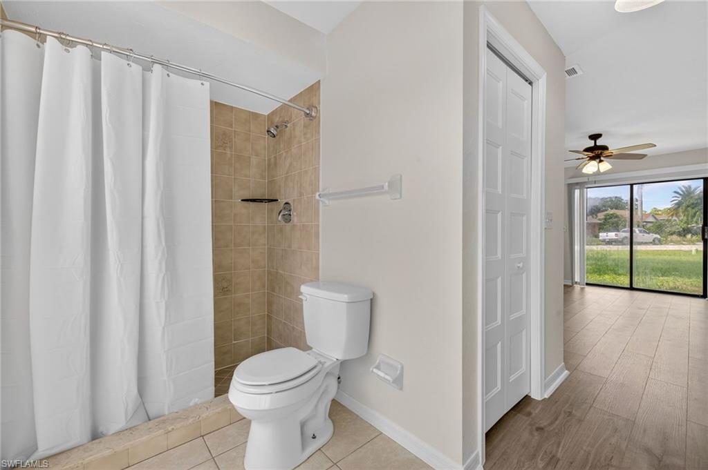 18294 Lee Road Fort Myers, FL 33967 - Photo 17 of 37 a bathroom with a toilet and a shower