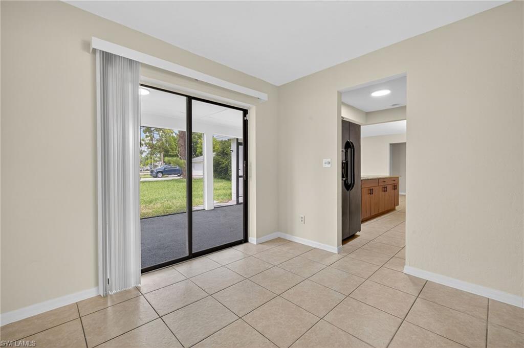 18294 Lee Road Fort Myers, FL 33967 - Photo 21 of 37 a view of an entryway with wooden floor