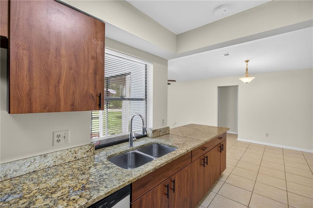 18294 Lee Road Fort Myers, FL 33967 - Photo 4 of 37 a kitchen with a sink and cabinets