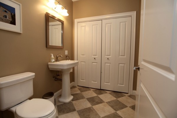 40 Hamilton Road Waltham, MA 02453 - Photo 23 of 30 a white toilet sitting next to a bathroom sink