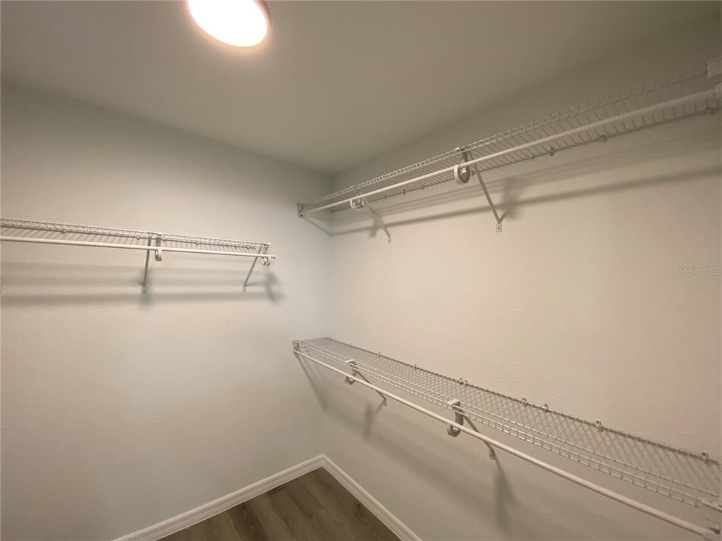 2827 Southwest 140th Loop Ocala, FL 34473 - Photo 18 of 29 a view of a room with racks on the wall