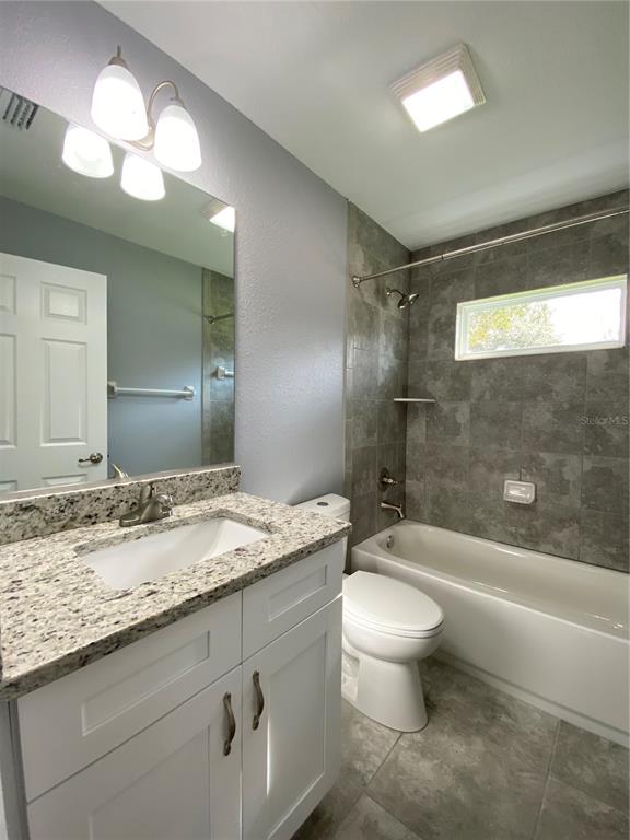 2827 Southwest 140th Loop Ocala, FL 34473 - Photo 21 of 29 a bathroom with a granite countertop sink toilet and shower