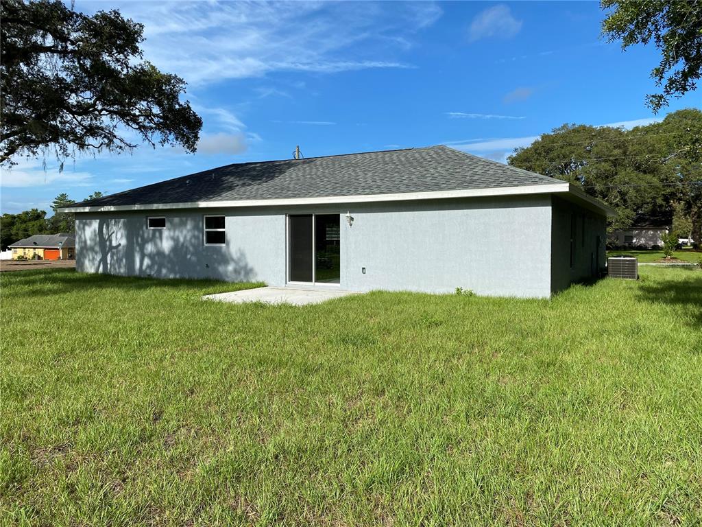 2827 Southwest 140th Loop Ocala, FL 34473 - Photo 29 of 29 a front view of house with yard and green space