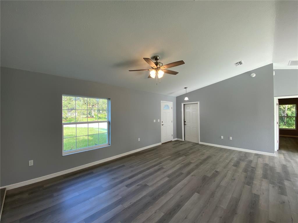 2827 Southwest 140th Loop Ocala, FL 34473 - Photo 6 of 29 a view of an empty room with a window