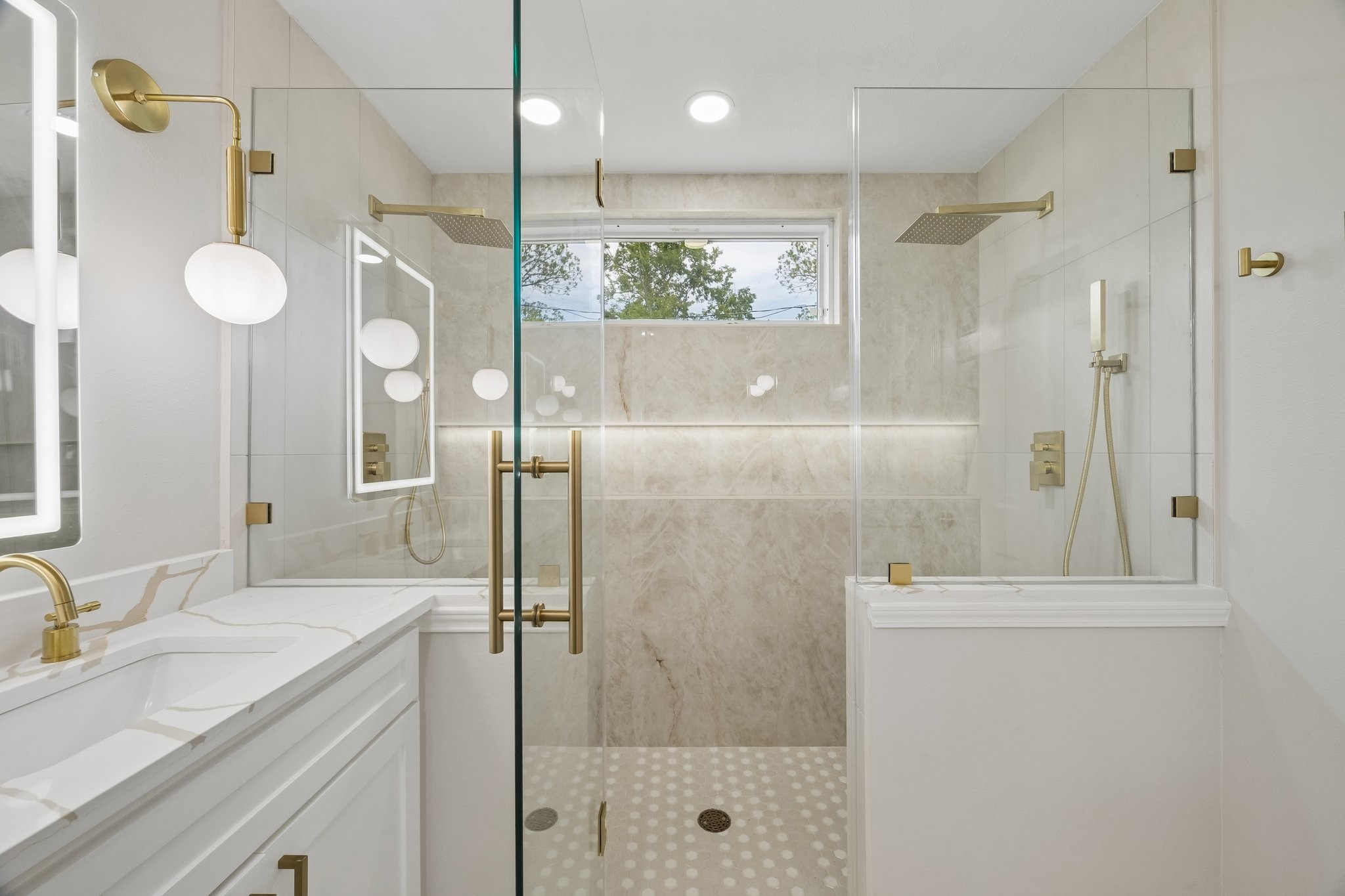 4203 Mowery Road Houston, TX 77047 - Photo 6 of 16 a bathroom with a shower sink and mirror