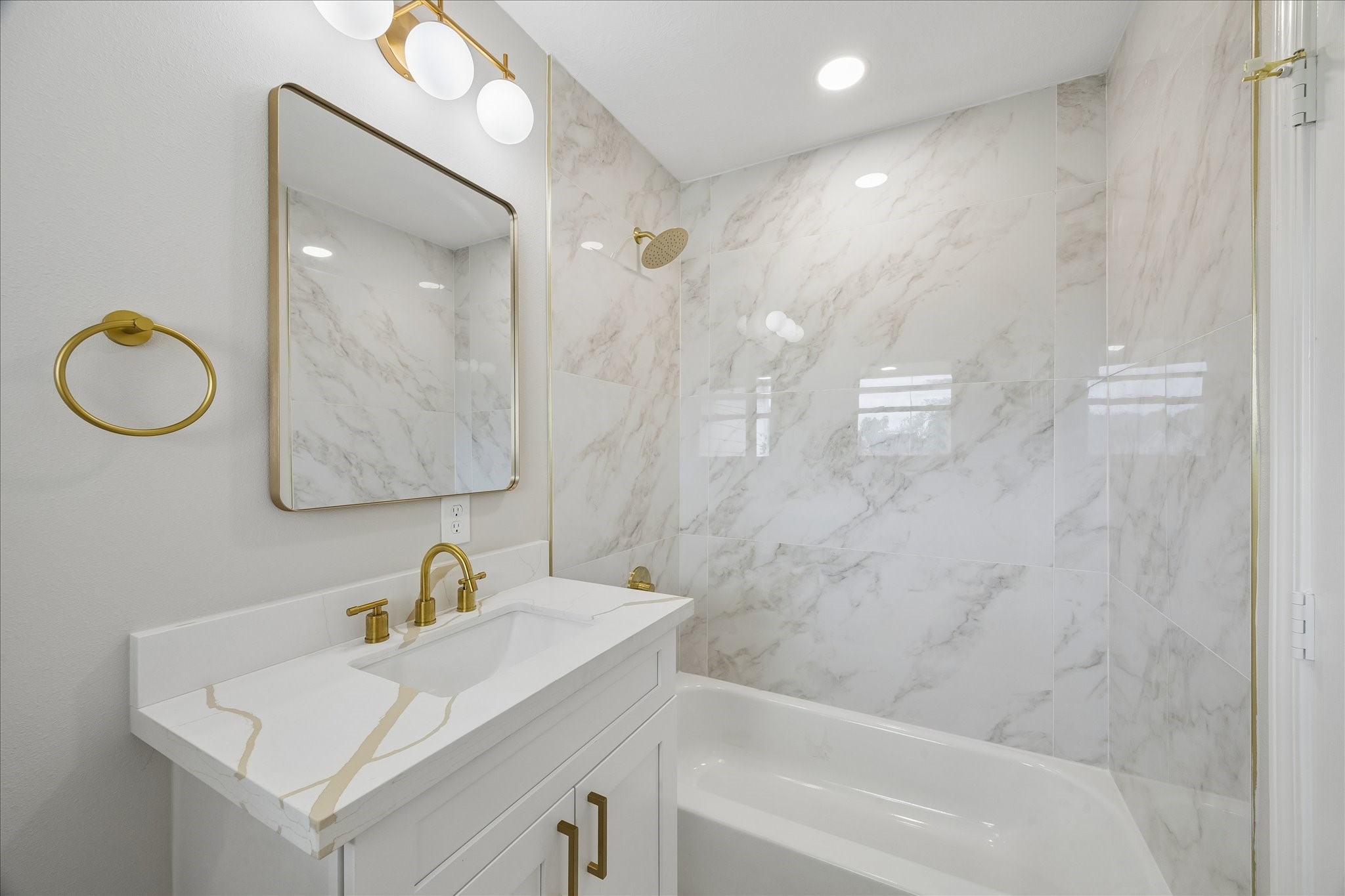 4203 Mowery Road Houston, TX 77047 - Photo 10 of 16 a bathroom with a sink vanity granite tub and a mirror