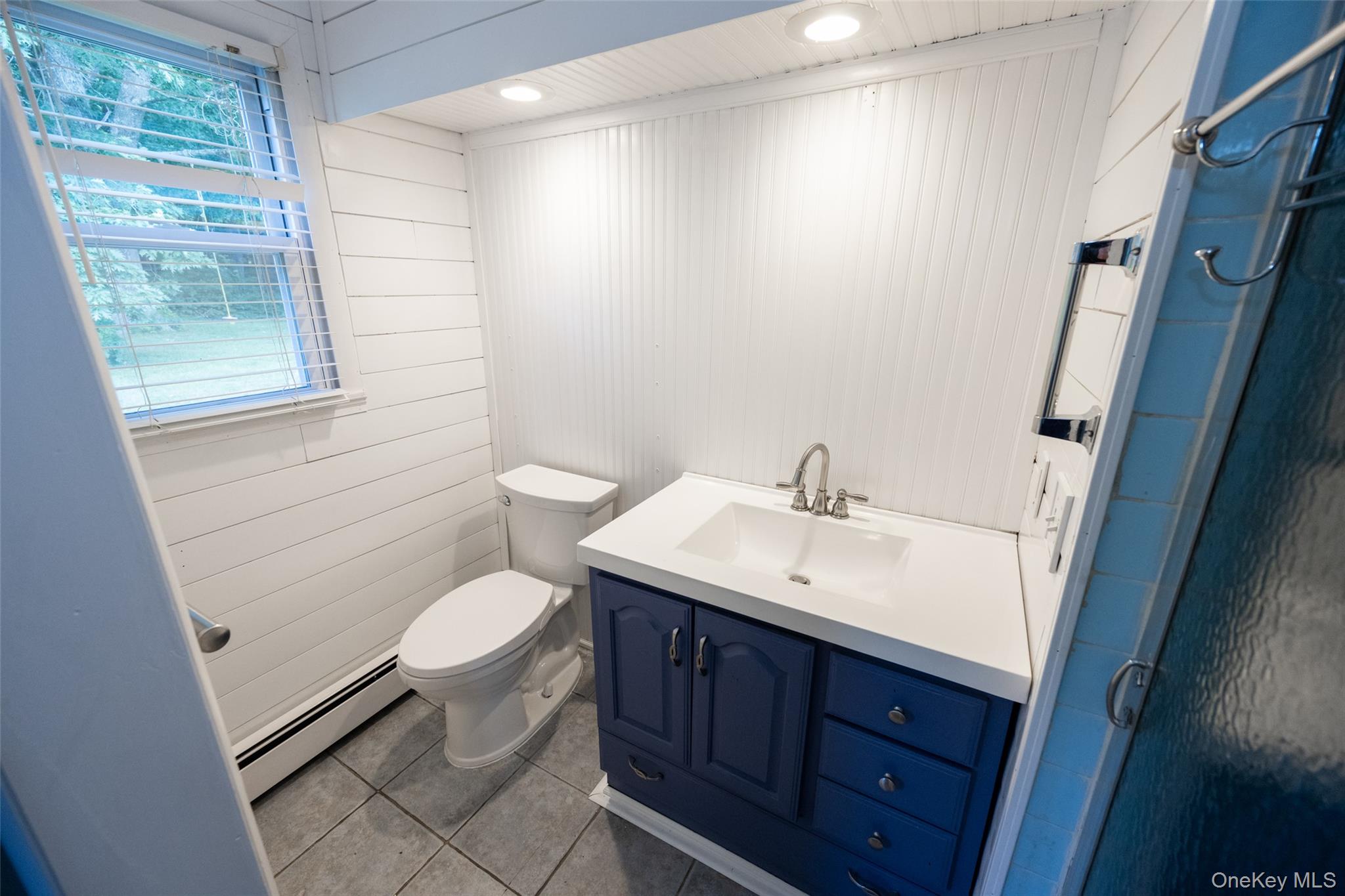 136 Foggintown Road Brewster, NY 10509 - Photo 26 of 50 a bathroom with a sink toilet and window