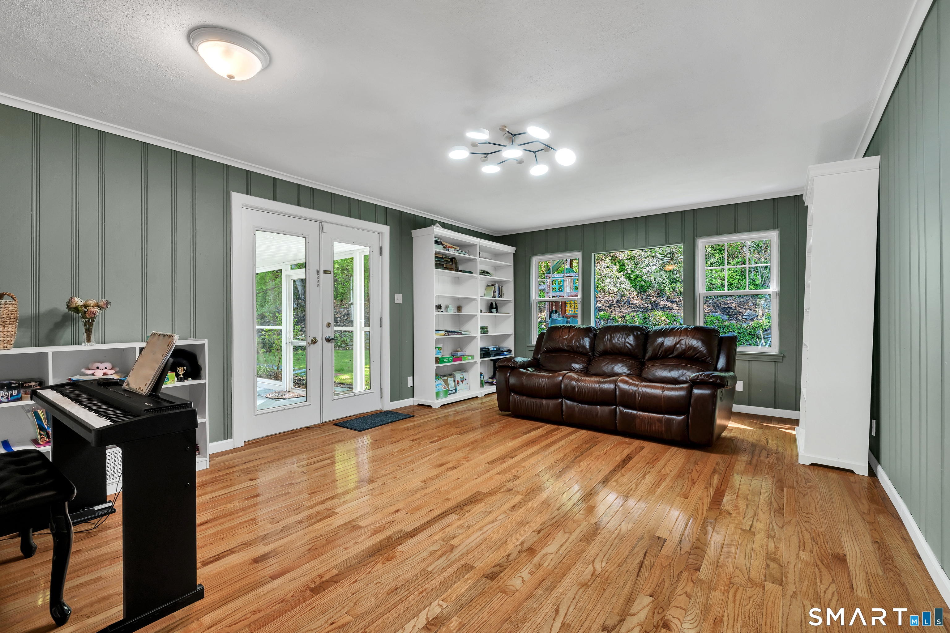 62 Edgewood Way New Haven, CT 06515 - Photo 12 of 39 Generous den features newer hardwood flooring