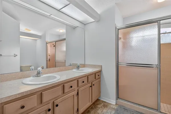 a bedroom with two beds and a table