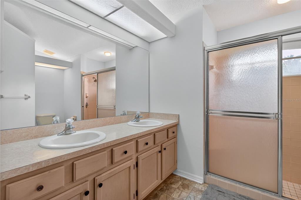 8841 Kipling Avenue Hudson, FL 34667 - Photo 20 of 41 a bathroom with a sink double vanity and a mirror