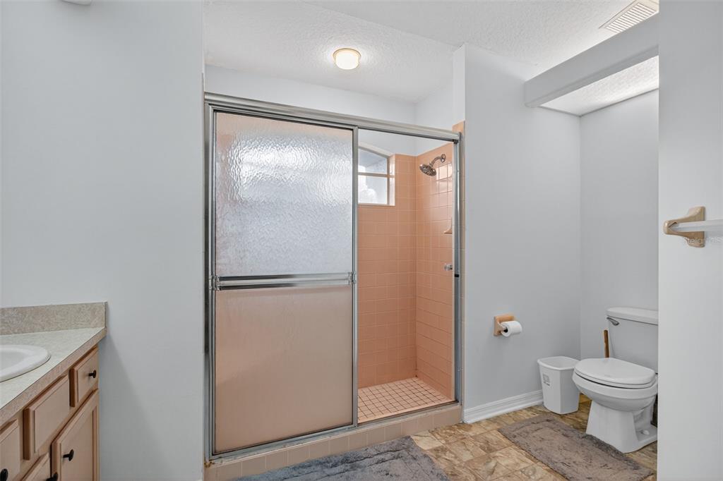 8841 Kipling Avenue Hudson, FL 34667 - Photo 21 of 41 a bathroom with a toilet shower and a sink