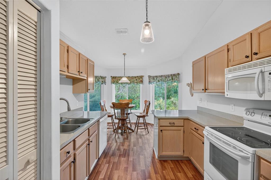 8841 Kipling Avenue Hudson, FL 34667 - Photo 24 of 41 a kitchen with sink cabinets and wooden floor