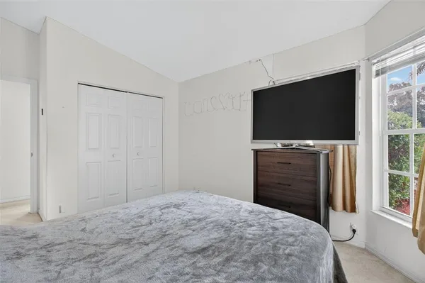 a view of a field with trees in the background