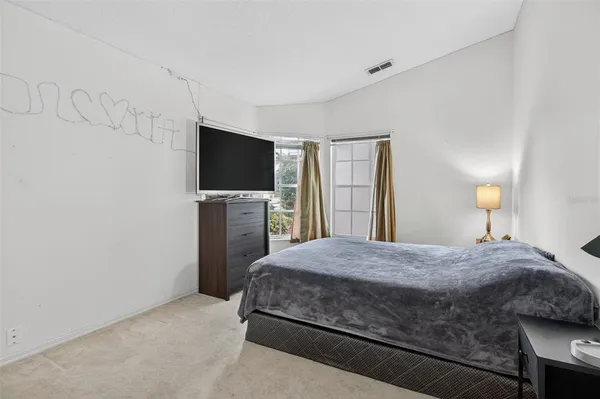 aerial view of a house with a yard