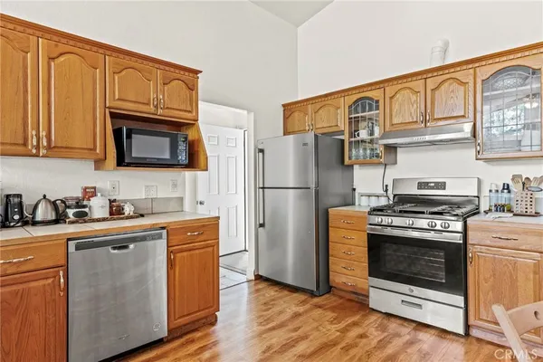 a kitchen with a table chairs and a stove