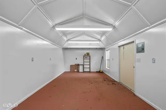 a view of a big room with closet and windows