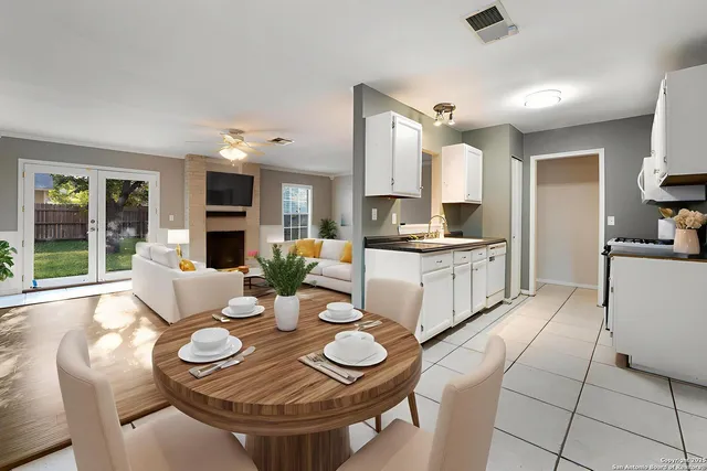 a open dining room with furniture and window