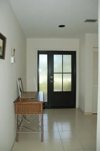 a room with a table and windows