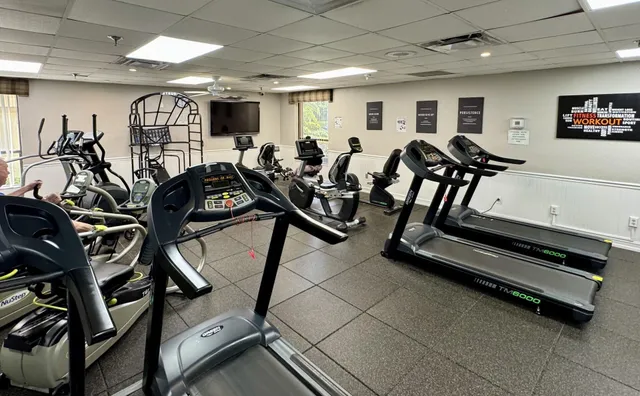 a picture of a room with lots of stuff and furniture