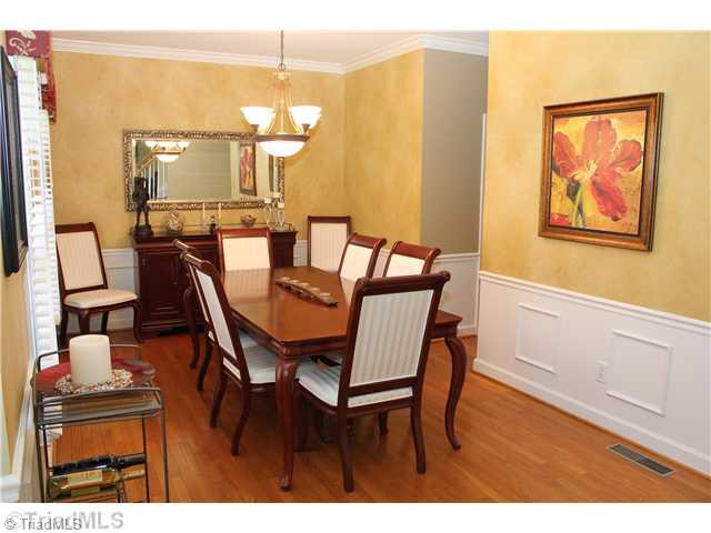 537 Barrett Road Winston-Salem, NC 27104 - Photo 2 of 16 Dining Room. Spacious dining room with hardwoods, updated light fixture, chair rail -- beautiful first impression