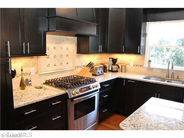 537 Barrett Road Winston-Salem, NC 27104 - Photo 3 of 16 Kitchen. Tile, granite, custom built ins, pen lights, Bosch gas range... oooh la la!