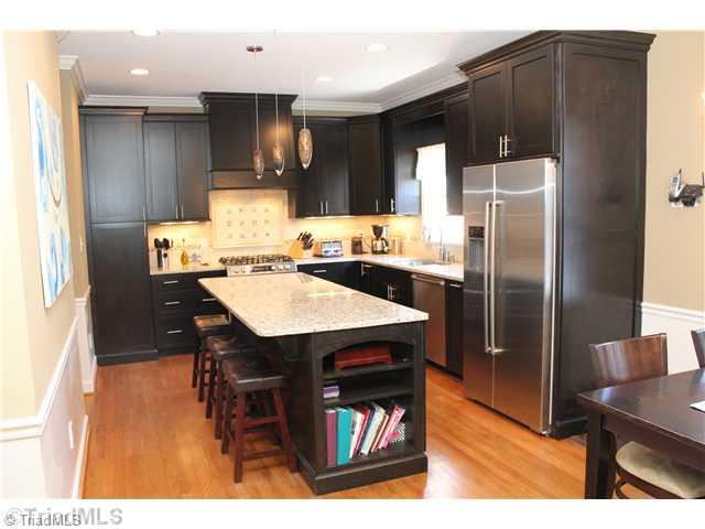 537 Barrett Road Winston-Salem, NC 27104 - Photo 4 of 16 Kitchen. Huge island in kitchen with bar seating & custom built ins opens nicely to spacious breakfast area
