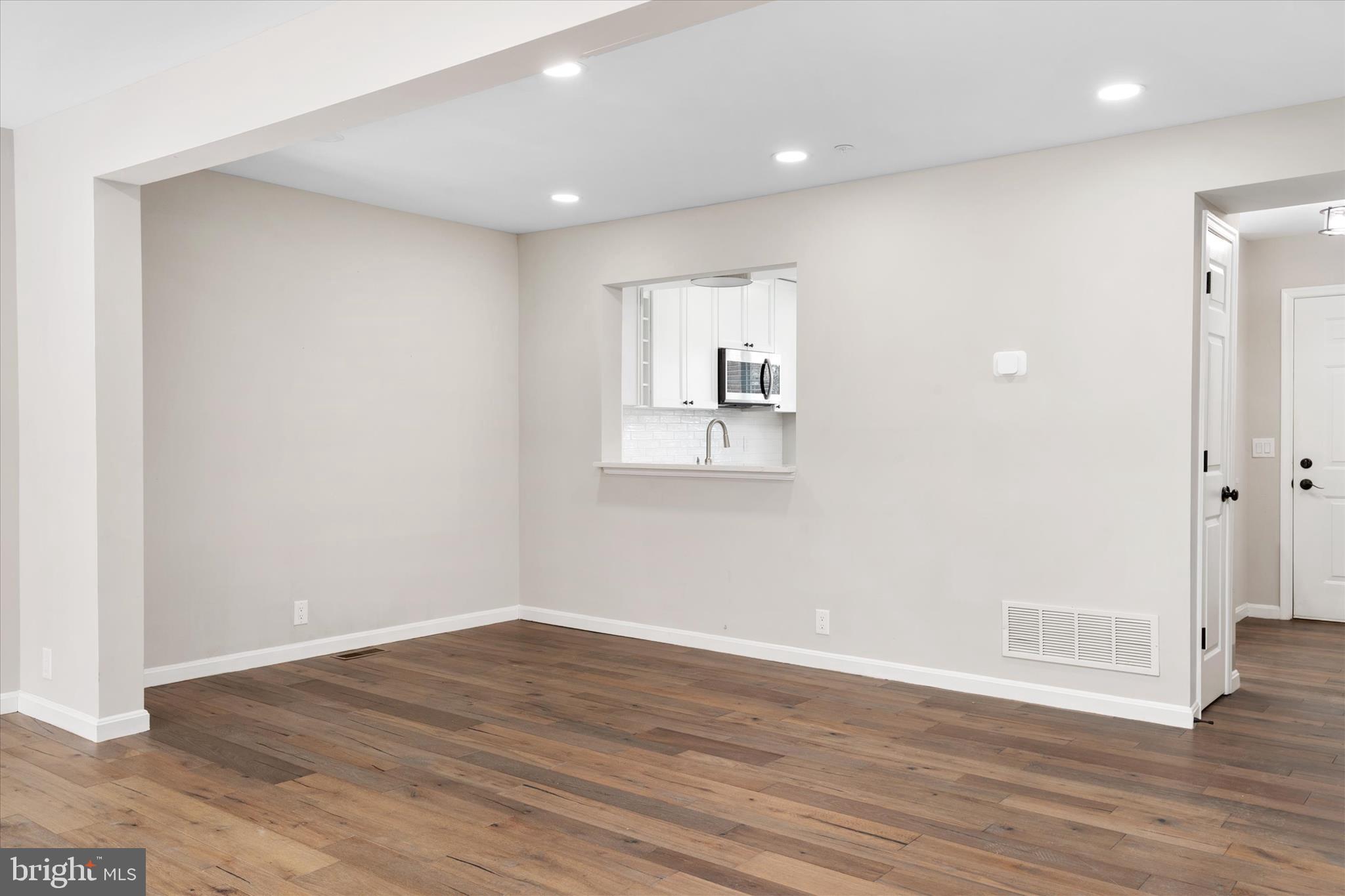 1711 Glebe Creek Way Odenton, MD 21113 - Photo 11 of 33 a view of empty room with wooden floor
